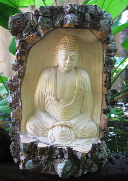 Hand Carved Buddha in a Log