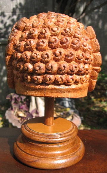 Hand Carved Pipek Head statue  from Meatless Coconut